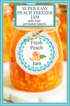 a jar filled with fresh peach jam sitting on top of a table