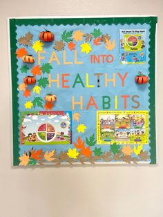 a bulletin board that says fall into healthy habitts