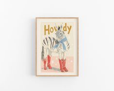 a zebra wearing red boots is standing in front of a white wall with the words howdy on it