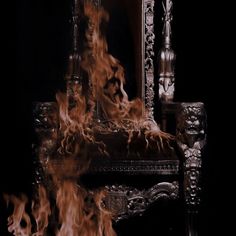 a chair that is on fire in the dark