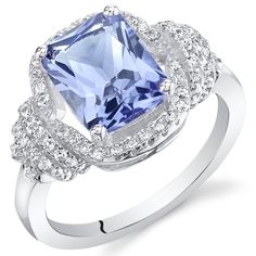 A multidimensional experience Add a sedated elegance to any ensemble with this unrestrained Tanzanite beauty. This standout ring features a cushion cut Peora simulated Tanzanite gemstone in .925 sterling silver. Technically crafted and cut for optimum brilliance, our simulated Tanzanite gemstones are optically identical to their mined counterparts, but they are made using alternative materials. We're big fans of eco-luxury. Handcrafted in pure .925 sterling silver goodness, this ring has been carefully coated in an elegant rhodium finish. Our artisans are expertly trained in this process which fortifies the ring's strength, shine and brilliance. Too many pieces on your wishlist and can't decide? Good problems to have! Our concierge stylists are here to help with all of your jewelry questio Jewelry Questions, Blue Gemstone Rings, Blue Topaz Bracelet, Silver Cocktail, Tanzanite Ring, Tanzanite Gemstone, Fashion Jewelry Sets, Necklace Online, Sterling Silver Earrings Studs