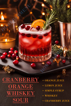 an advertisement for cranberry orange whiskey sour on a table with candles and decorations