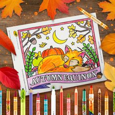 an autumn coloring book surrounded by crayons and leaves