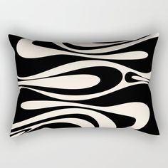 a black and white rectangular pillow with an abstract design on the front, featuring wavy lines