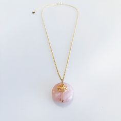 ⚜Item Specifics❀ Stone: Genuine Natural Rose Quartz❀ Flower: 14K Gold Filled Plum Blossom❀ Disc Size: 20 mm❀ Chain: 14K Gold Plated Sterling Silver❀ Length: 16 in. with 1.5 in. Extension Blooming even in the harshest of winters, the plum blossom represents the virtue of endurance and overcoming adversities. In the Divine Land, the plum blossom reminds us that even the most delicate beauty contains strength.A 14K gold plated sterling silver chain holds a genuine natural rose quartz stone accompan Delicate Round Pink Necklace, Pink Round Charm Necklace With Adjustable Chain, Elegant Pink Round Charm Necklace, Elegant Pink Round Charm Necklaces, Pink Gold Flower Pendant Necklace As Gift, Pink Gold Flower Pendant Necklace Gift, Gold Rose Quartz Round Pendant Necklace, Gold Rose Quartz Round Pendant Jewelry, Delicate Pink Gold Round Jewelry