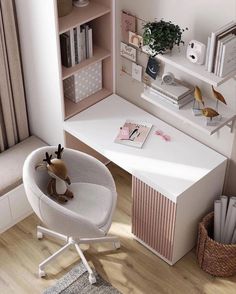 a white desk with a stuffed animal sitting on it's chair next to a book shelf