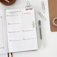 an open planner book sitting on top of a desk