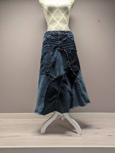 "Upcycled Silver Brand denim patchwork skirt with frayed seams and jagged hem. Waist measures 30\", hips 36\" and length is approximately 29\"." Dark Wash Patchwork Cotton Skirt, Dark Wash Cotton Patchwork Skirt, Cotton Patchwork Skirt In Dark Wash, Dark Wash Patchwork Denim Skirt, Dark Wash Denim Skirt With Patchwork, Recycled Denim Patchwork Denim Skirt, Recycled Denim Patchwork Skirt, Denim Blue Patchwork Skirt From Recycled Denim, Patchwork Denim Skirt In Recycled Denim Blue