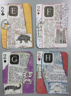 four playing cards with animals and letters on them, all made out of old book pages