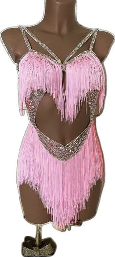 a female mannequin with pink fringes on it's chest and back