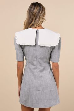 Sophisticated and playful at the same time, the Sister Jane Heron Heather Grey Bow Oversized Collar Short Sleeve Mini Dress is our new fave find! Midweight woven fabric boasts a heathered effect as it shapes short sleeves and a fitted bodice that features an oversized, statement collar with ruffled trim and a removable beaded bow detail. Fit-and-flare silhouette falls to a mini hem. Hidden zipper at back. Fit: This garment fits true to size. Length: Mid-thigh. Size uk m/us 6 measures 33.5" from shoulder to hem. Bust: Great for any cup size. Waist: Fitted - very fitted at natural waist. Hip: Not Fitted - fuller skirt allows room for hips. Undergarments: May be worn with any standard bra. Fabric: Fabric has no stretch. Lined. Shell: 65% Polyester, 30% Viscose, 5% Elastane. Contrast: 95% Poly Collar Mini Dress, Beaded Bow, Statement Collar, Sister Jane, Oversized Collar, Short Sleeve Mini Dress, Mini Dress With Sleeves, Bow Detail, Full Skirt