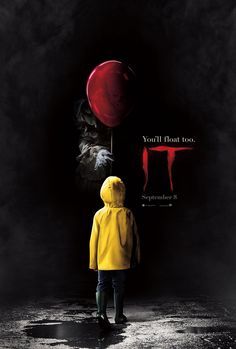 a child in a yellow raincoat is holding a red balloon with the words it on it