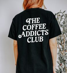 Coffee Addicts Shirt, Pour Over Coffee Lover, Iced Coffee Shirt, Coffee Beans, Coffee Shop Tshirt, But First Coffee, Official Member Shirt * This item is printed with direct-to-garment printing. This means the design will look a bit more vintage and have a little more texture than other printing methods Product details: * Gildan brand * 100% cotton (fiber content may vary for different colors) * Medium fabric (5.3 oz/yd² (180 g/m * Classic fit * Tear-away label * Runs true to size Sizing: * This Coffee Color Cotton Tops For Streetwear, Coffee Color Short Sleeve Top With Slogan, Coffee Color Short Sleeve Top With Text Print, Coffee Color Graphic Tee Shirt With Short Sleeves, Coffee Colored Crew Neck Top For Streetwear, Casual Coffee Crew Neck Top For Streetwear, Coffee Colored Cotton Slogan Top, Coffee Colored Slogan Short Sleeve Top, Coffee Colored Short Sleeve Slogan Top