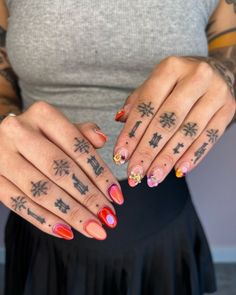 a woman with many tattoos on her hands