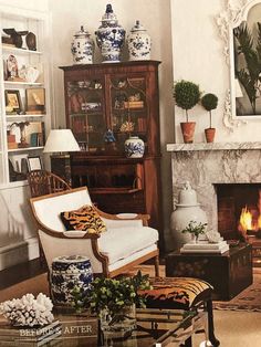 a living room filled with furniture and a fire place