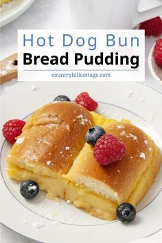 hot dog bun bread pudding with raspberries and powdered sugar on white plate