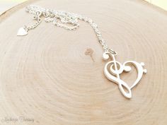 ♬ This Heart Music Note Necklace will be a great gift for any musician, music lover, or teacher. ∙ ∙ ∙ ∙ ∙ ∙ ∙ ∙ ∙ ∙ D E T A I L S ∙ ∙ ∙ ∙ ∙ ∙ ∙ ∙ ∙ ∙ * Material: High Quality Solid Sterling Silver 925 (safe for sensitive skin). * Finish: Sterling Silver ∙ Yellow Gold Plated ∙ Rose Gold Plated * Handcrafted with Love and Care ♥ Our 18k gold plated jewelry is much thicker than other gold plating, resulting in a durable, long-lasting product. ∙ ∙ ∙ ∙ ∙ ∙ ∙ ∙ ∙ ∙ T U R N ∙ A R O U N D ∙ T I M E ∙ ∙ Heart-shaped Music-themed Jewelry Gift, Music-themed Heart-shaped Jewelry Gift, Silver Heart-shaped Music-themed Jewelry, Music-themed Silver Heart Jewelry, Music-themed Pendant Necklaces As Gift, Music-themed Pendant Necklace As Gift, Music-themed Pendant Necklace, Music-themed Jewelry For Valentine's Day Gift, Musical Note Jewelry