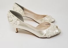 Ivory Bridal Shoes with a beautiful lace, pearl and crystal design.  The comfortable 2 inch shoes in the listing (also available in 3 inch heels) have been dyed Medium Ivory, but is also available in white and light ivory or over 100 different colors as well as the option of sending us a sample to color match for you!   If you would like a different heel size, please leave us a note in the personalization box or the listing pair of 2 heel will be made up for you. *All dyed shoes can bleed when e Emerald Green Wedding Shoes, Dyed Shoes, Bridal Shoes Lace, Wedding Shoes Ivory, Red Bridal Shoes, Lace Wedding Shoes, Lace Bridal Shoes, Sparkly Wedding Shoes, Blue Bridal Shoes