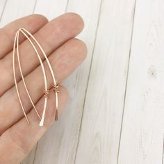 These hand-forged lightweight threader earrings go perfectly with any outfit. These rose gold-fill drops measure in at a little over two inches. Simple and elegant. An absolute crowd pleaser! Available in any combination of sterling silver, gold fill or rose gold fill. Please convo me for a different metal combination. Your Rachel Dawn Designs piece will come in a recycled box topped with a bow for you or a friend! PLEASE note this is handmade jewelry. There will be slight differences as each pi Minimalist Rose Gold Long Drop Threader Earrings, Minimalist Rose Gold Wrap Earrings As Gift, Minimalist Rose Gold Wrap Earrings For Gift, Minimalist Rose Gold 14k Gold-filled Threader Earrings, Handmade Minimalist Threader Earrings, Rose Gold Dainty Linear Earrings, Dainty Rose Gold Linear Earrings With Ear Wire, Minimalist Rose Gold Wrap Earrings, Dainty Rose Gold Wrap Earrings