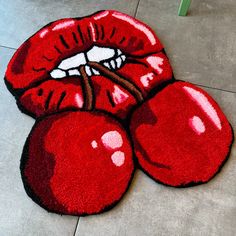 a red rug with an image of a kiss on the lips