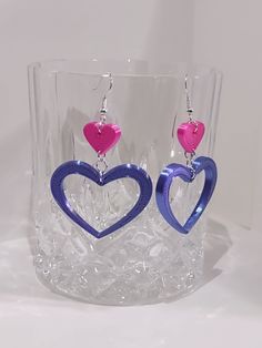 These stylish and unique heart earrings were designed and printed by me. They were then carefully linked together to create the finished earrings.  The hearts are printed using a pink, and silk purple tough PLA. Check out our shop for other trending earring designs, and 3D printed products! Pink Heart Hoop Earrings For Gift, Pink Metal Heart Earrings For Pierced Ears, Pink Heart Hoop Earrings As Gift, Pink Heart-shaped Hoop Earrings For Gifts, Pink Heart Earrings For Pierced Ears, Pink Nickel-free Double Heart Earrings, Pink Double Heart Pierced Earrings, Pink Open Heart Earrings Gift, 3d Printed Heart