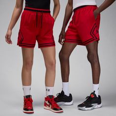 Unmistakably iconic, the Jordan Woven Diamond shorts have reclaimed the spotlight. Constructed from a relentless four-way stretch-woven fabric and amped with moisture-wicking magic, this pair ensures you stay cool, dry, and stylish. No matter if you're dominating the court or strutting your stuff off-court, from sinking free throws to tackling the checkout line, these shorts guarantee an air of freshness that's locked in—a statement not to be ignored. Stretch-woven fabric feels lightweight, dura Red Nylon Sportswear Bottoms, Casual Red Go-dry Shorts, Functional Red Nylon Bottoms, Red Go-dry Sportswear Shorts, Sporty Red Nylon Athletic Shorts, Sporty Red Activewear For Outdoor Activities, Red Nylon Sporty Athletic Shorts, Red Sporty Activewear For Outdoor, Casual Red Breathable Athletic Shorts