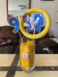 a vase filled with cereal sitting on top of a table