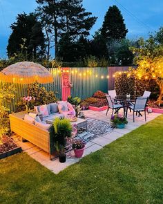 an outdoor patio is lit up with string lights