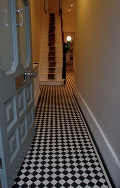 a black and white checkered floor with stairs