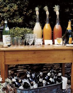 bottles and glasses are sitting on a table