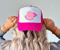 Make a bold statement with our "Whatever" trucker hat, featuring a playful design of a mouth chewing pink bubble gum. This hat combines attitude with style, perfect for those who like to express their unique personality. The front panel showcases a vibrant graphic of a mouth blowing a pink bubble gum, with the word "Whatever" written in a fun, casual font. The design pops against the classic white background, making it a standout piece. Crafted from high-quality materials, this cap offers a comf Hats For Men Trendy, Backwards Hat, Trendy Caps, Casual Fonts, Retro Hat, Retro Hats, Women Hat, Cap For Men, Pink Bubbles