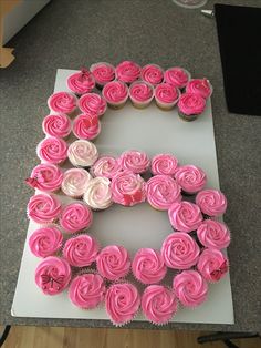 cupcakes are arranged in the shape of a heart