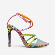 A Strappy Sandal Pump With A Clear Strap. Material: Faux-Leather Features: Sd Dream Sole Double The Padding For Comfort, Support, And Ease Of Movement Outside Heel Height: 4" Closure: Adjustable Buckle Imported Multicolor Open Heel Synthetic Sandals, Trendy Strappy Synthetic Heels, Colorful Synthetic Heels With Round Toe, Colorful Round Toe Synthetic Heels, Trendy Colorful Synthetic Sandals, Trendy Colorful Synthetic Heels, Multicolor Strappy Sandals For Party, Multicolor Strappy Sandals For Spring, Colorful High Heel Synthetic Heels