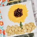 there is a plate with food on it that looks like sunflowers and cornflakes