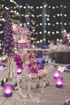 the table is set with candles and flowers