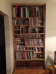 an old wooden bookcase filled with lots of books