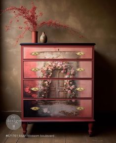 a dresser with flowers painted on it