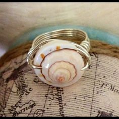 Seashell Ring🐬 Unique Seashell Ring 🐬 Artisan made with Sterling Silver Plated Wire. ☀️ Custom Size ☀️ Can also be done in Gold Wire Jewelry Rings Silver Shell-shaped Ring For Gift, Silver Shell Rings For Beach, Silver Shell Rings For Gift, Handmade Silver Round Shell, Silver Shell-shaped Rings For Beach, Handmade Adjustable Silver Shell, White Sterling Silver Shell For Beach, Gold Wire Jewelry, Seashell Ring