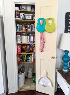 an open door to a pantry filled with food