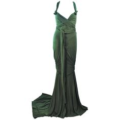 This Elizabeth Mason Couture gown is composed of bamboo jersey. Features a wrap style with a drop neckline. may be fashioned in a variety of colors. The gown may be fashioned in a variety of colors. This is a couture custom order. Please allow for a 60 day lead time from measurements, fabric selection, patterning, toile fitting, to final product. The dress shown is a sample size 2. The sample is not for purchase. Measurements of sample size: Length: 55" +10" Train Bust: 30" Waist: 26" Hip: 38" Blue Couture Gowns, Black Dinner Dress, Blue Velvet Gown, White Jersey Dress, Drape Gown, Drapey Dress, Jersey Evening Dress, Gowns Black, Vintage Evening Gowns