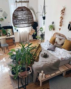 a bedroom with lots of plants in it