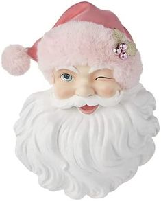 a close up of a santa claus head on a white background with a pink hat