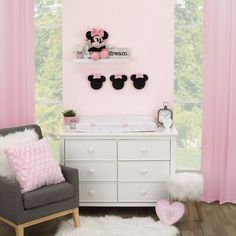 Add a pop of Disney magic to your little one's nursery with the Minnie Mouse-shaped plush wall décor. This adorable Minnie Mouse head-shaped silhouette wall décor includes three pieces; each with a big pink bow! Place the set of three together or throughout the room to create the nursery of your dreams! Disney | Disney Nojo Minnie Mouse Shaped Plush 3D Wall Decor 6.36 H x 7.5 W x 2.0 D in black / pinkFabric in Black;pink | 6.36" H X 7.5" W | Wayfair Minnie Mouse Baby Room, Minnie Mouse Room Decor, Mickey Mouse Bedroom, Mouse Wall, 3d Wall Decor, Baby Minnie Mouse, 3d Wall, Disney Magic