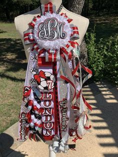 a mannequin is decorated with ribbons and letters