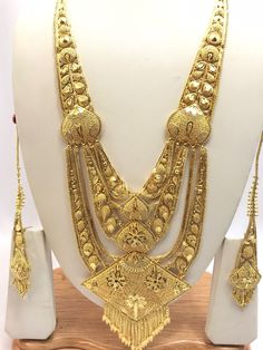 Handmade Indian Jewelry Asian Wedding Bridal Jewellery Party Ethnic Wear 22ct Gold Plated Bridal Necklace Set Rani Haar Bridal Jewellery Set  PLEASE NOTE, This Item Is Not Real Gold .Only Good Quality Gold Plated Jewellery .it is Artificial Jewellery.  It is a perfect match with formal attire on special occasions or with casual wearing.  Slight Colour variations possible due to difference in screen and photograph Care instructions Keep Jewellery away from direct heat, water, perfumes, deodorants Traditional 22k Gold Tikka, Gold Sets With Pallu For Festivals, 22k Gold Meenakari Bridal Necklace For Wedding, Gold Sets With Pallu Detail For Festivals, Gold Bollywood Sets For Diwali, Bollywood Style Gold Sets For Diwali, Gold Plated Bridal Necklace For Puja And Festivals, Gold Meenakari Bridal Necklace In 22k Gold, Gold Plated Tikka For Festivals