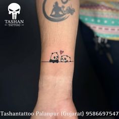 two panda bears on the wrist tattoo by tashantoo palapur gupaat