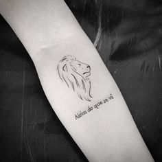 a lion tattoo on the arm with an inscription above it that reads, albin do you love?