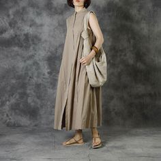 Stand Collar Sleeveless Shirt Dress Cotton Linen Maxi A-Line Dress in Khaki Black One Size - Morimiss.com Sleeveless Shift Midi Dress For Daywear, Sleeveless Shift Midi Dress For Work, Sleeveless Maxi Dress For Spring Workwear, Beige Sleeveless Shift Dress, Beige Shift Sleeveless Dress, Beige Shift Dress Sleeveless, Spring Workwear Sleeveless Maxi Dress, Spring Sleeveless Maxi Dress For Work, Sleeveless Cotton Maxi Dress For Work