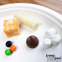 several different types of candy on a white plate