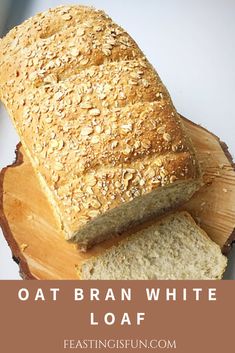 a loaf of oat bran white loaf sitting on top of a cutting board